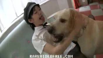 Young woman having intercourse with a dog