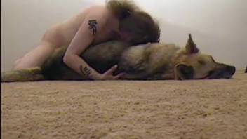 Dirty man gently screws his adorable pet dog