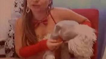 Bare lady flaunts herself on webcam in genuine bestiality porn footage